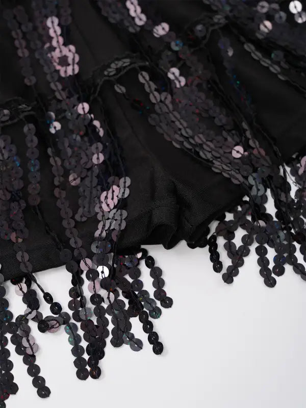 Black sequined fringe garment.