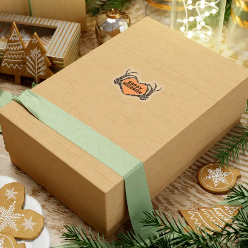 Kraft paper gift box with a mint green ribbon band and a small decorative sticker.