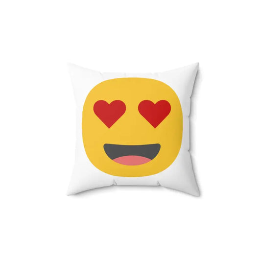 White throw pillow featuring a yellow emoji with heart-shaped eyes and a big smile.