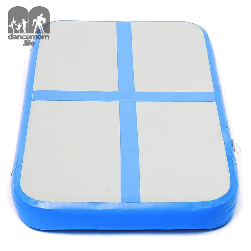 Blue and white inflatable gymnastics mat.