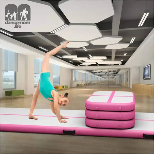Pink and white inflatable gymnastics mat.