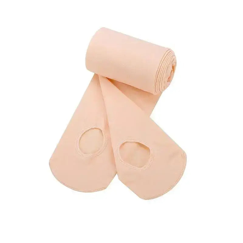 Ballet tights with holes for the feet in a pale pink color.