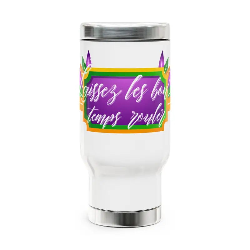 White travel tumbler with colorful French text and rainbow accents.