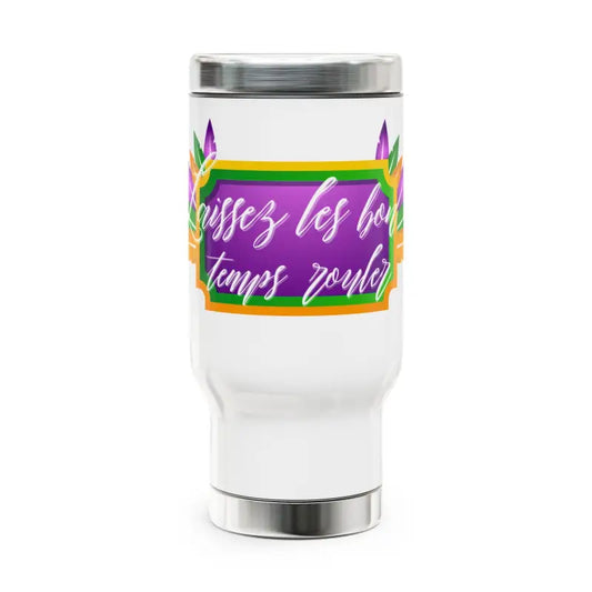 White travel tumbler with colorful French text and rainbow accents.