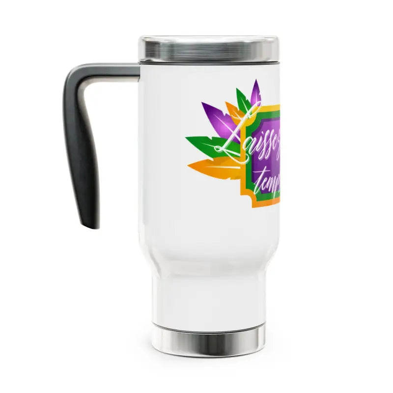 White travel mug with a colorful tropical leaf design and black handle.
