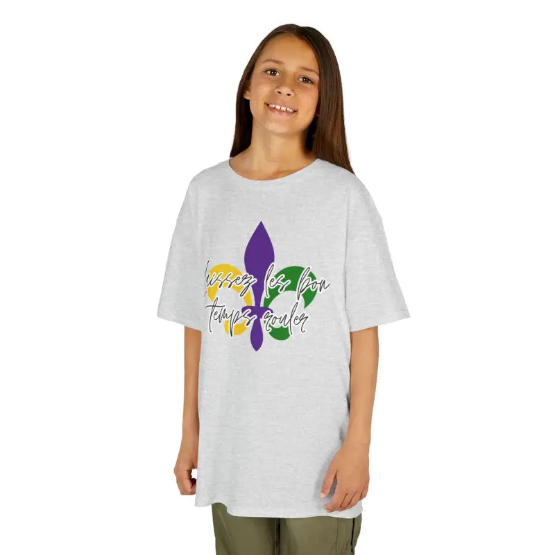 White t-shirt with a purple fleur-de-lis design and text.