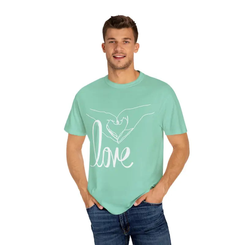 Mint green t-shirt with white ’love’ text and hand design.