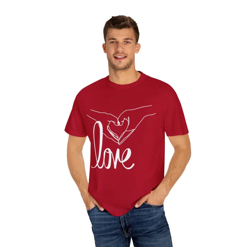 Red t-shirt with white ’love’ text and hand design graphic on the front.