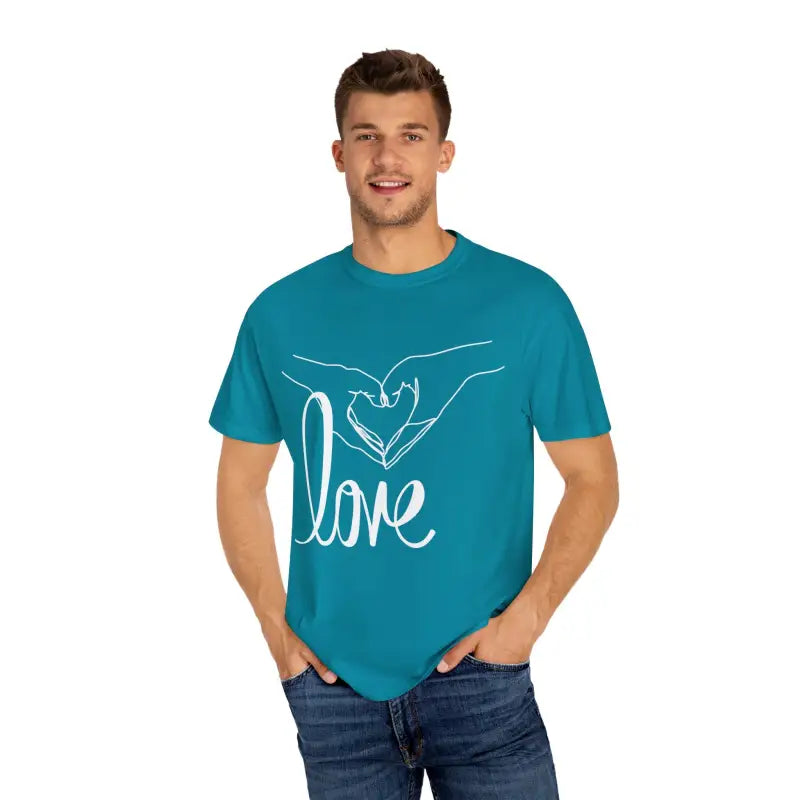 Teal t-shirt with white ’love’ text and hand-drawn heart design.
