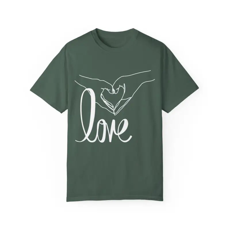 Green t-shirt with white hand-drawn heart gesture and ’love’ text design.