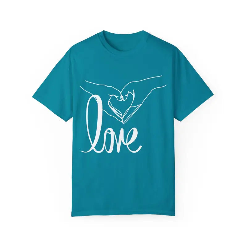 Teal t-shirt with white hands forming a heart shape and ’love’ text design.