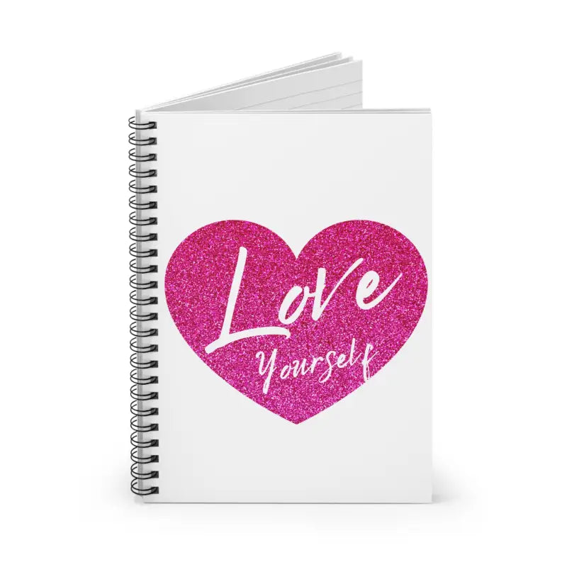 Spiral notebook with a pink glittery heart and ’Love Yourself’ text on the white cover.