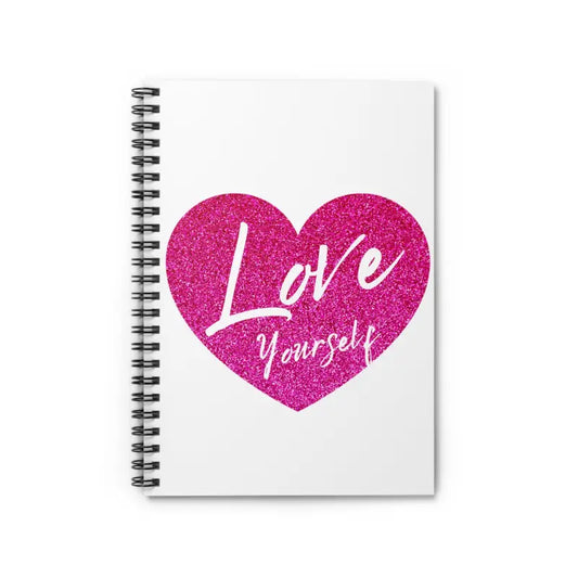 Spiral notebook with a pink glittery heart containing ’Love Yourself’ text on the cover.