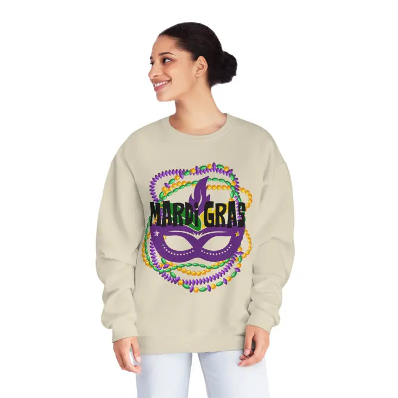Beige sweatshirt featuring a colorful Mardi Gras mask design with purple, green and gold accents.