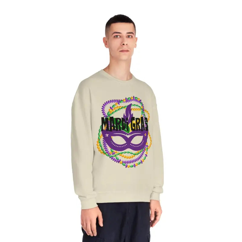 Beige sweatshirt featuring a colorful Mardi Gras carnival mask design with purple and green accents.