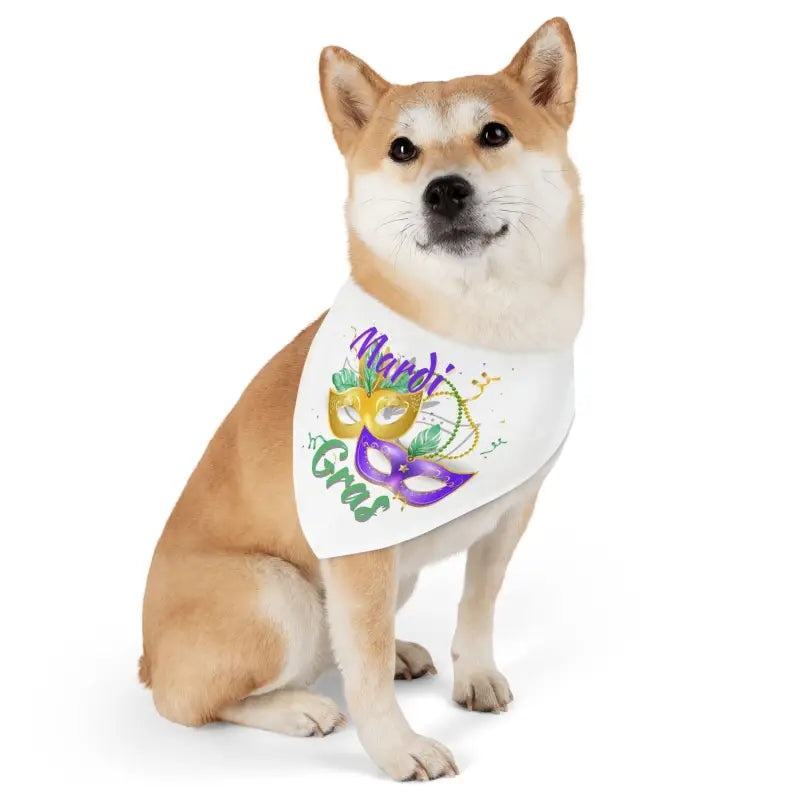 Shiba Inu dog wearing a white bandana with Mardi Gras mask design.