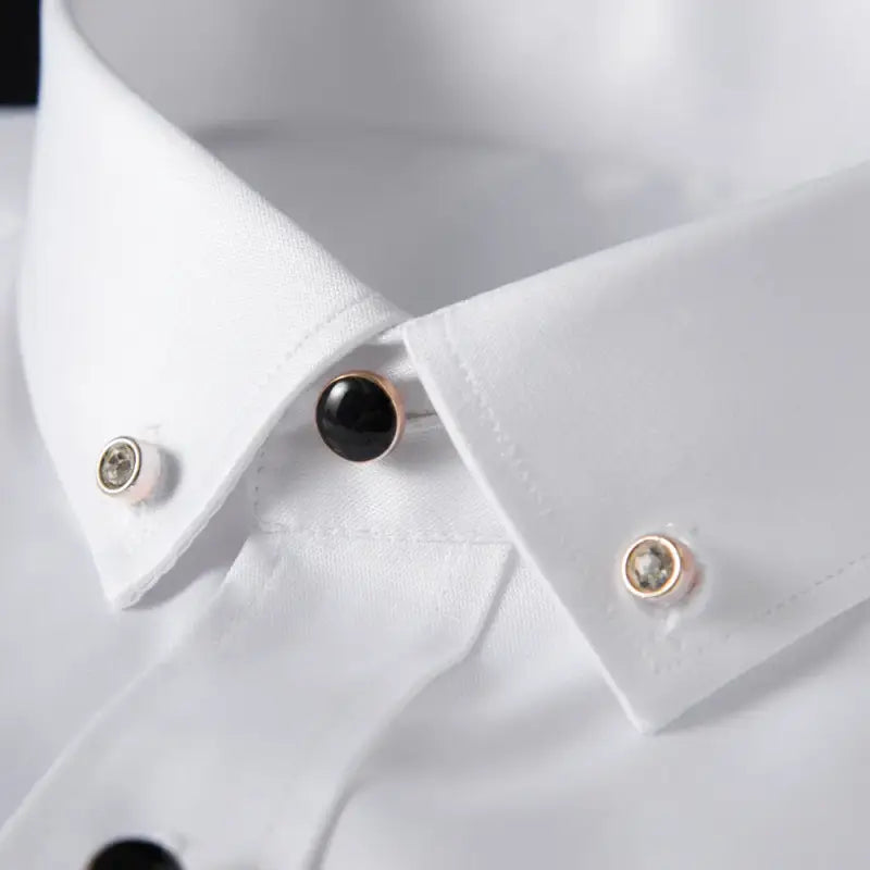 White dress shirt with decorative collar pins.