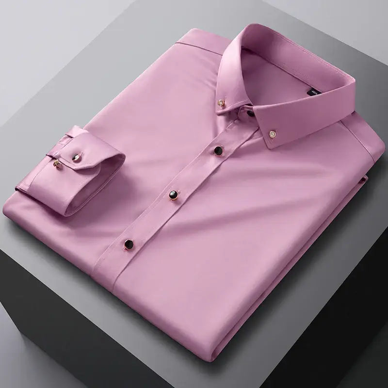 Pink dress shirt with dark buttons.
