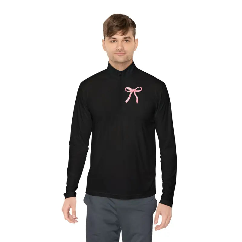 Black turtleneck sweater with a pink bow accent on the chest.