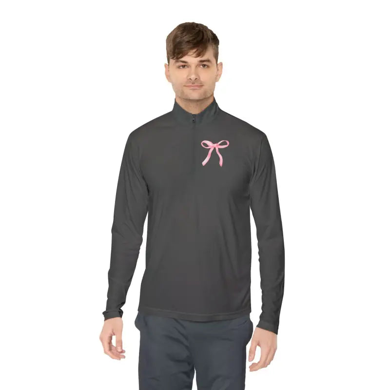 Dark gray athletic quarter-zip pullover with a pink ribbon accent on the chest.