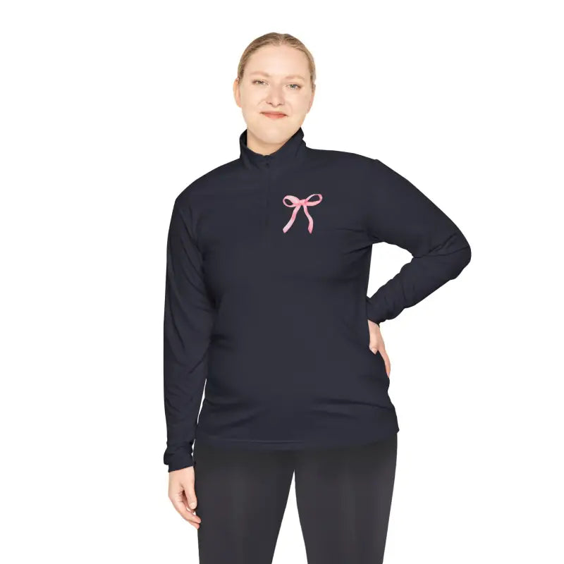 Navy blue turtleneck sweater with a pink bow embroidered on the chest.