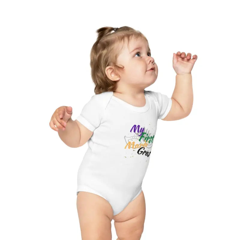 White baby onesie with colorful text design on the front.