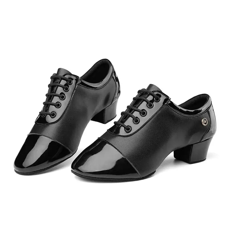Pair of black leather dance shoes.