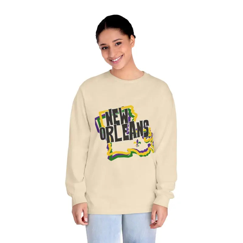 Beige sweatshirt with colorful ’New Orleans’ text and fleur-de-lis design.