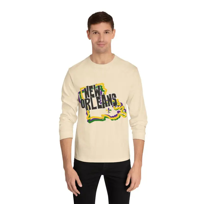 Cream-colored long sleeve t-shirt with ’New Orleans’ text design featuring Mardi Gras colors and decorative elements.