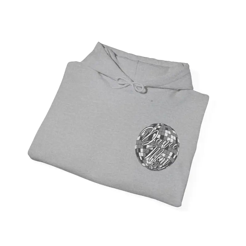 Light gray folded sweatshirt with a circular metallic logo design.
