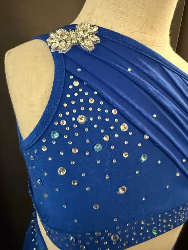 Blue, jeweled, one-shoulder dance costume.