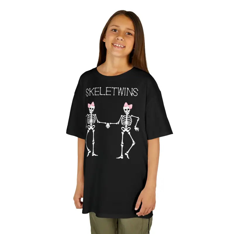 Black t-shirt featuring two cartoon skeletons holding hands with ’SKELETWINS’ text above them.