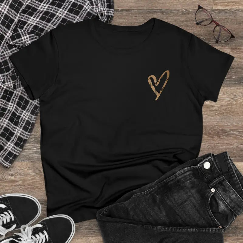 Black t-shirt with a small gold heart design on the chest.