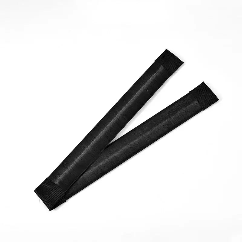 Two black hair bun makers.