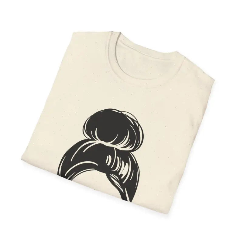 Cream-colored t-shirt with a black messy bun hairstyle graphic design.