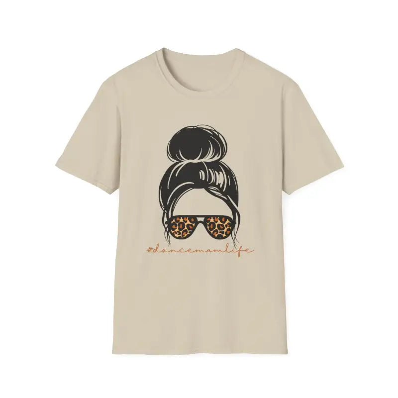 Beige t-shirt featuring a messy bun hairstyle illustration with leopard print sunglasses.