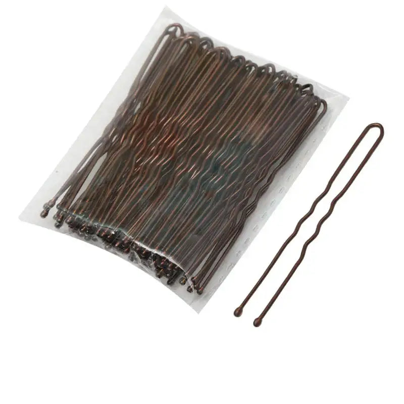 Brown metal bobby pins arranged in a clear plastic package.