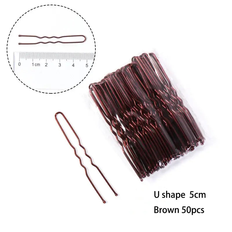 Brown U-shaped metal hair pins with wavy texture.