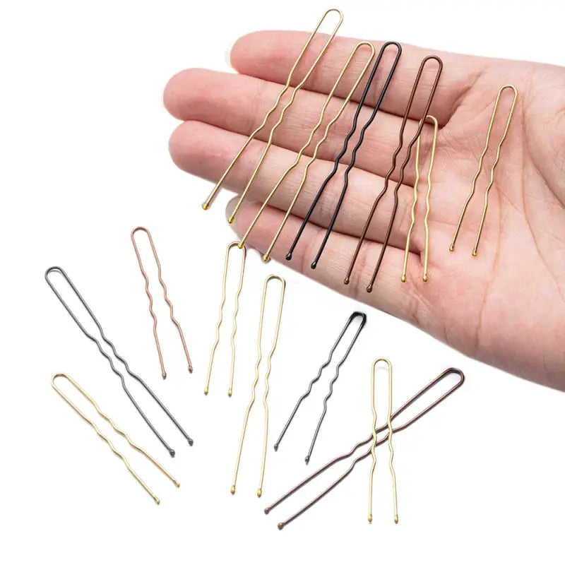 Hair pins in gold, silver, and black colors.