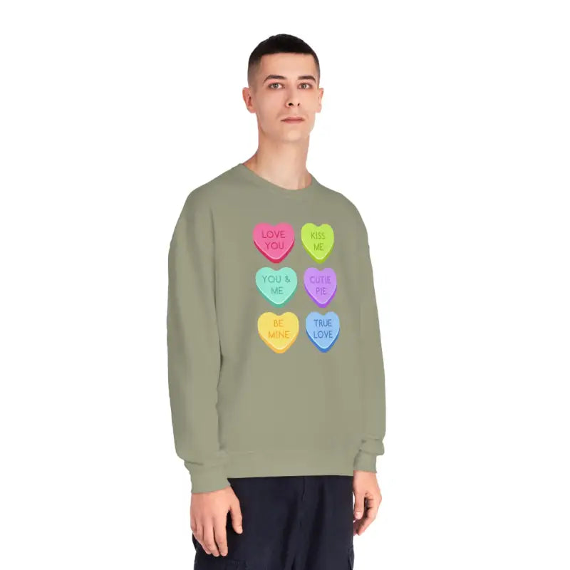 Sage green sweatshirt featuring colorful candy heart designs with text messages.