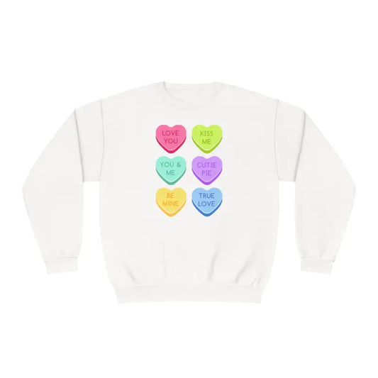 White sweatshirt featuring six colorful heart-shaped candy designs arranged in rows.