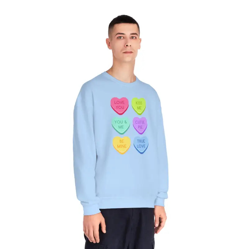 Light blue sweatshirt featuring colorful candy heart designs arranged in a grid pattern.