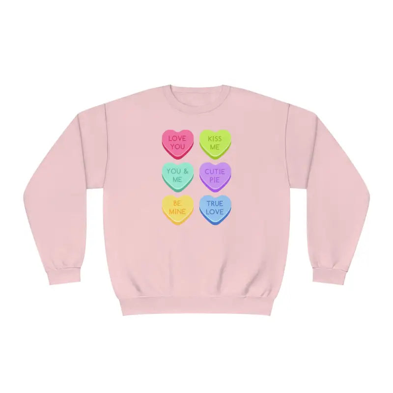 Pink sweatshirt with colorful candy heart designs printed on the front.