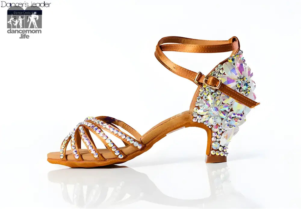 Rhinestone-studded tan dance shoe.