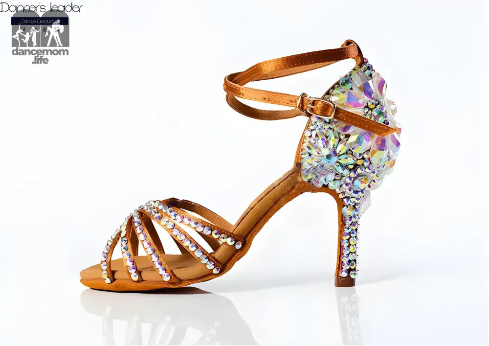 Rhinestone-studded tan dance shoe.