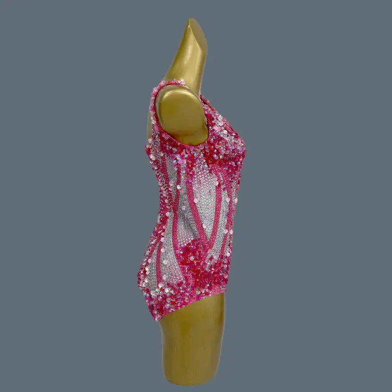 Pink sequined bodysuit.