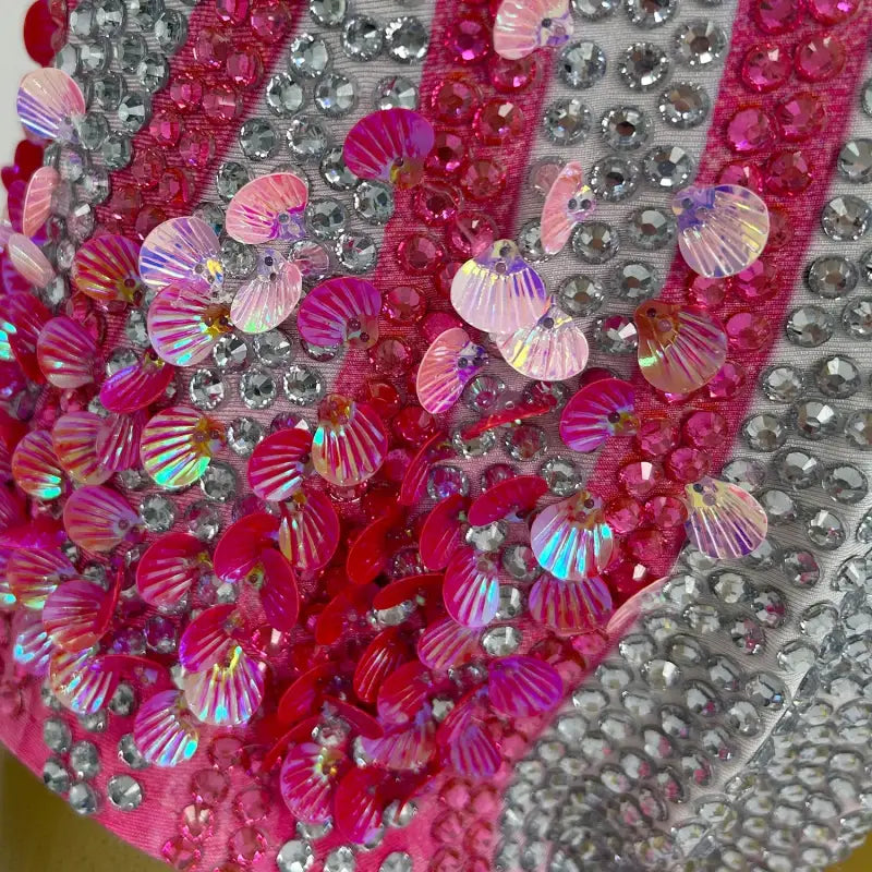 Sequined and jeweled pink and silver fabric.