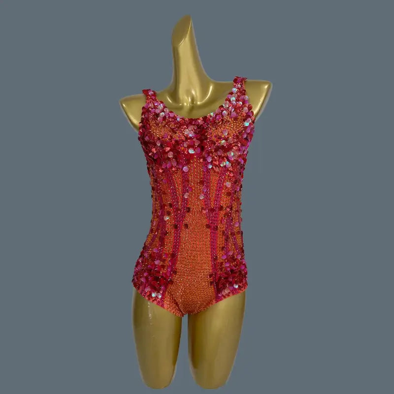 Orange and pink sequined bodysuit.