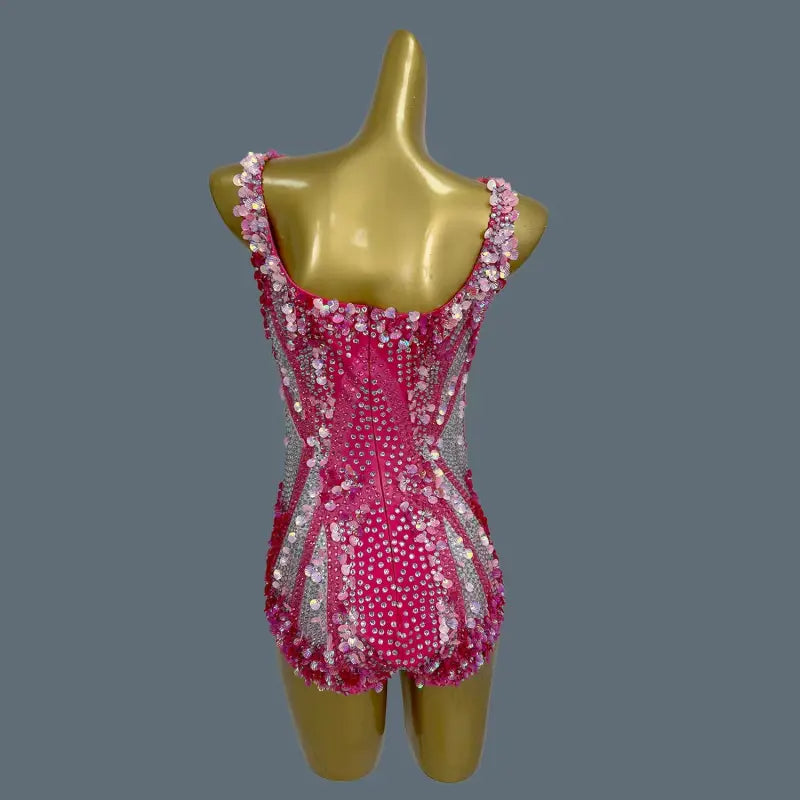 Pink sequined bodysuit.