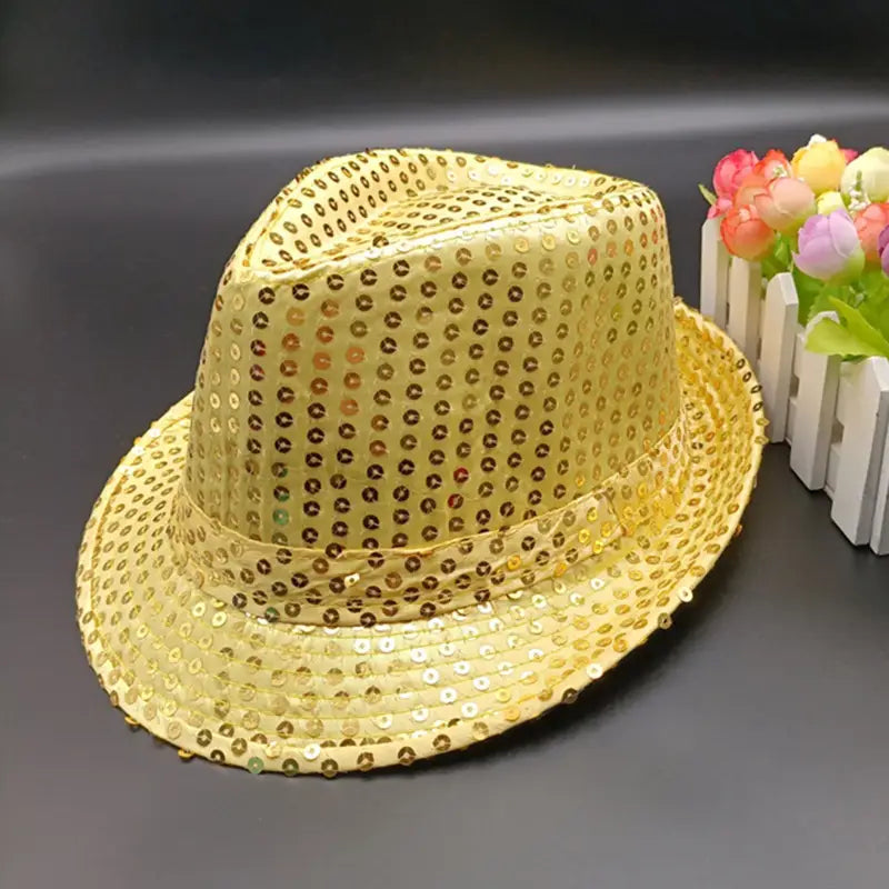 Gold sequined fedora hat with a shiny metallic finish.
